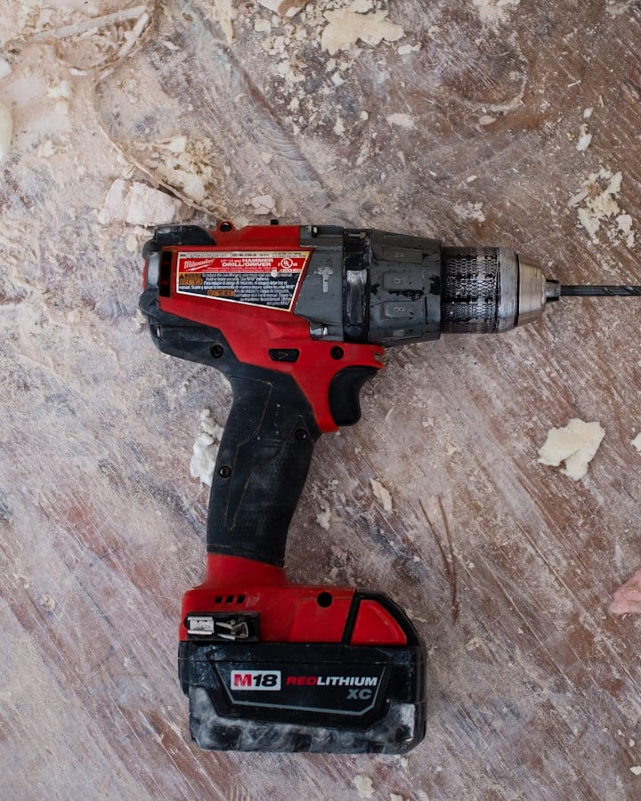 Remodeling work in progress — a drill resting on a job-site surface